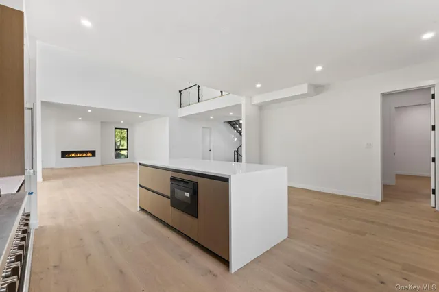 a kitchen with stainless steel appliances a stove and cabinets