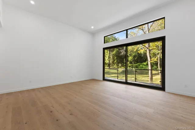 a bathroom with a sink mirror and a bathtub