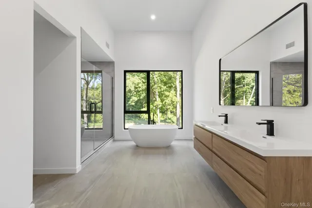 a bathroom with a toilet a sink and shower