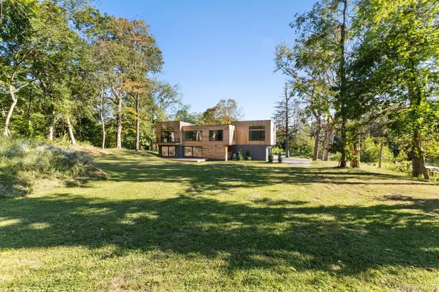 a swimming pool view with a outdoor seating