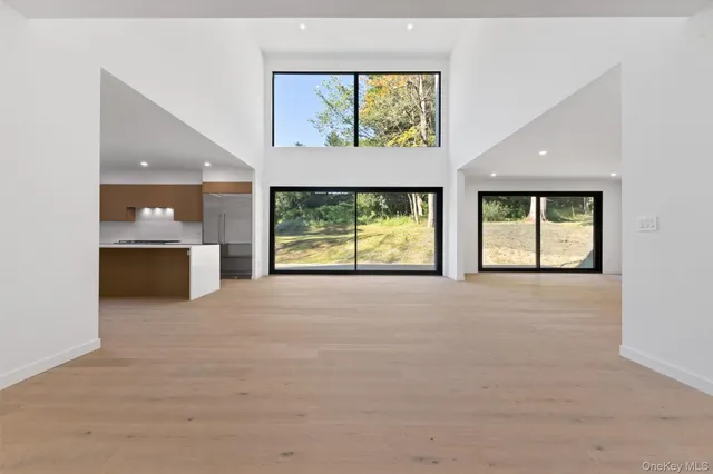 an empty room with windows and view