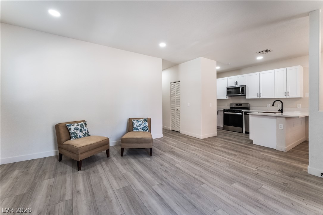 4730 East Craig Road, Unit 1058 Las Vegas, NV 89115 - Photo 30 of 30 An open floorplan seamlessly connects the living space to a well-appointed kitchen.