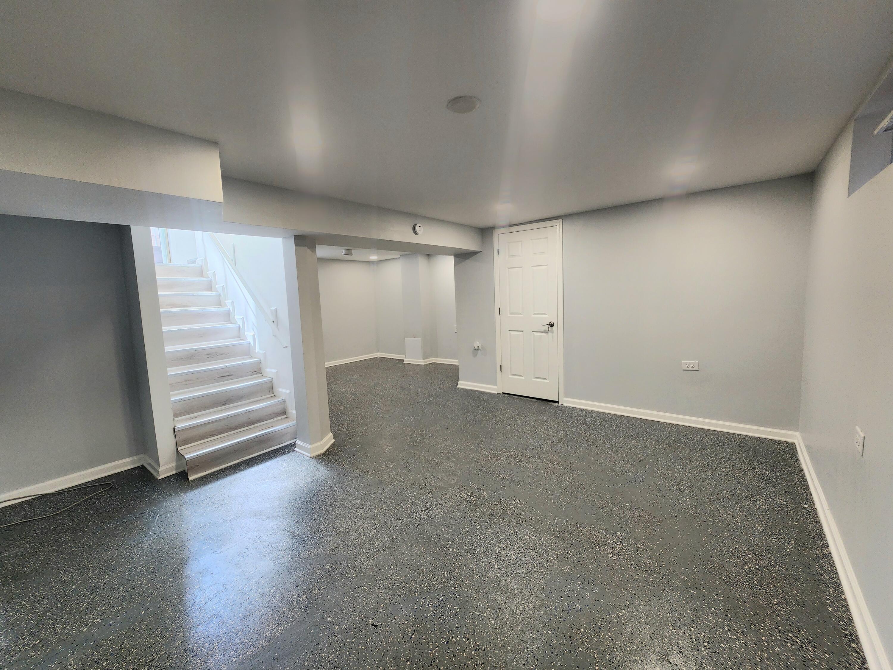 851 Johnson Street Gary, IN 46402 - Photo 14 of 24 a view of a room with stairs and a ceiling fan