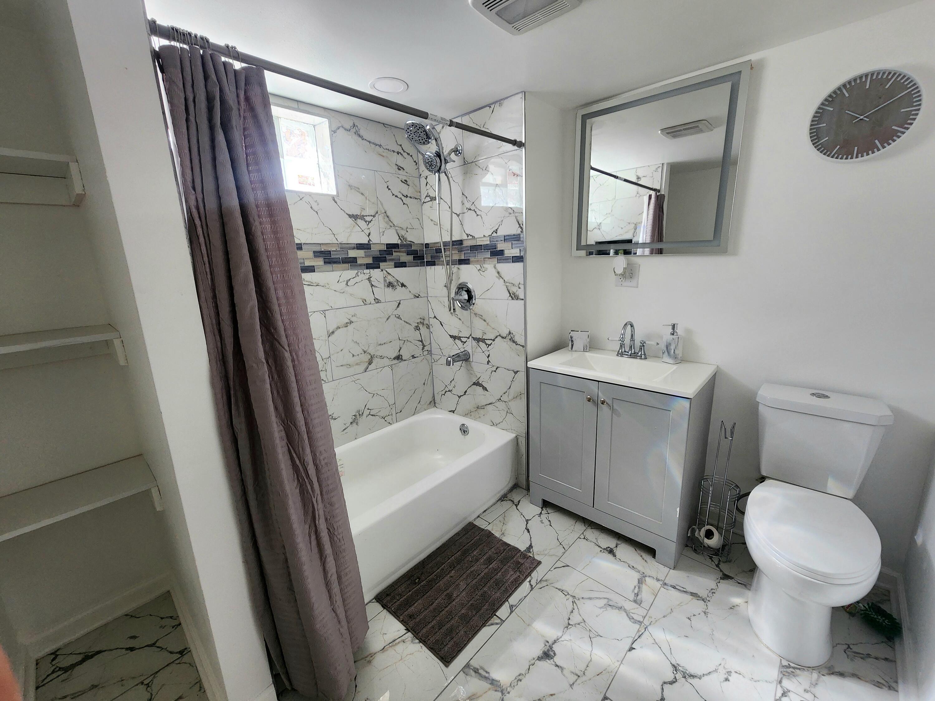 851 Johnson Street Gary, IN 46402 - Photo 17 of 24 a bathroom with a sink toilet and shower