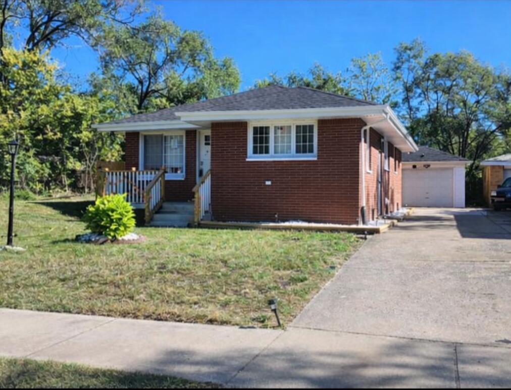851 Johnson Street Gary, IN 46402 - Photo 2 of 24 a front view of a house with garden