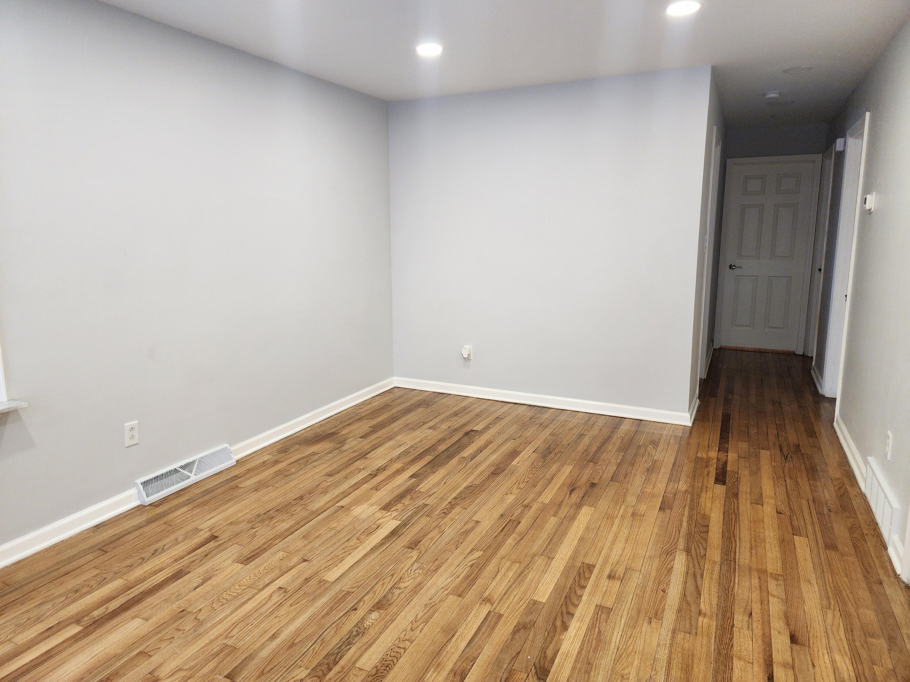 851 Johnson Street Gary, IN 46402 - Photo 4 of 24 a view of a room with wooden floor and bench