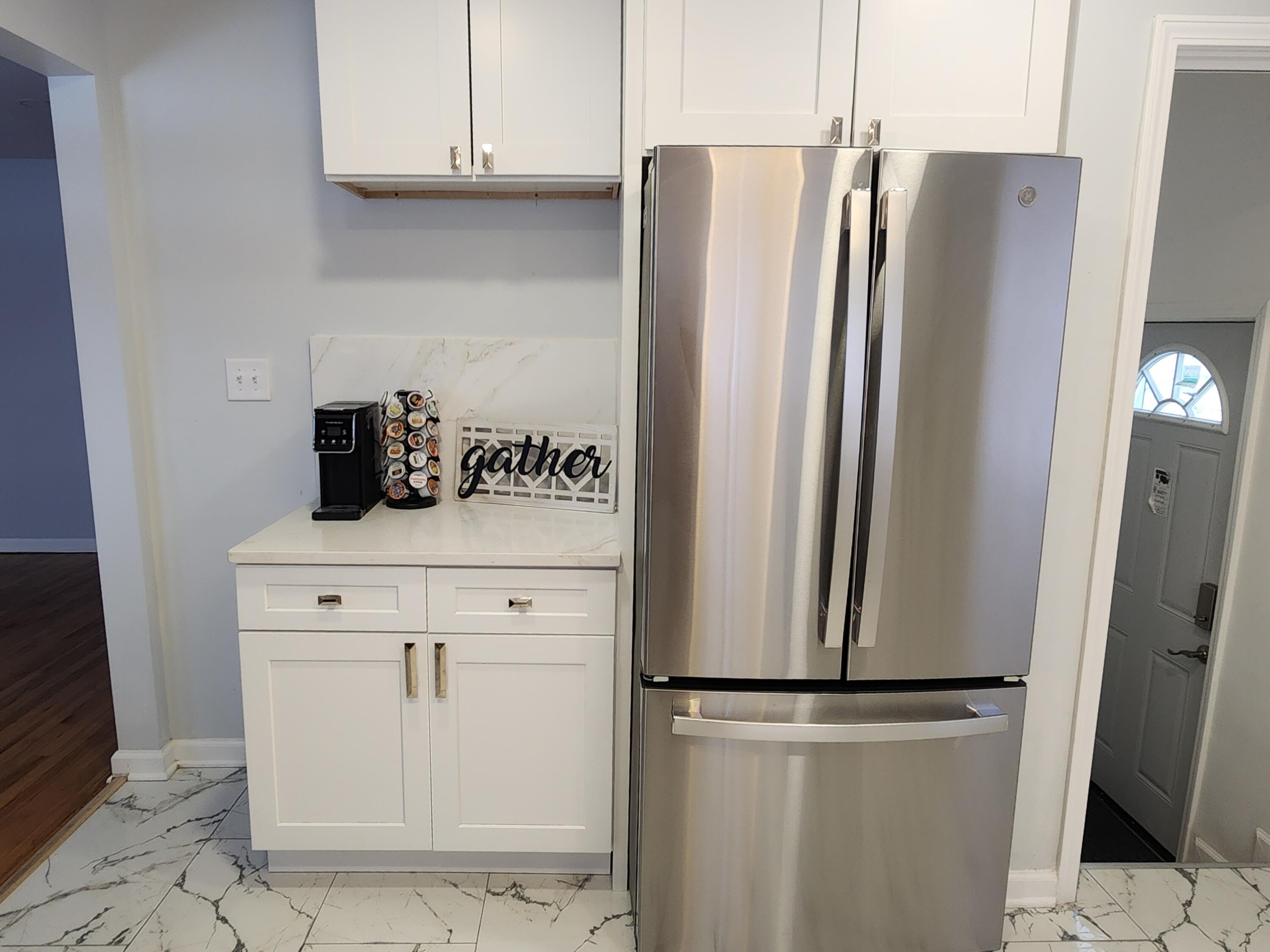 851 Johnson Street Gary, IN 46402 - Photo 6 of 24 a kitchen with refrigerator and cabinets