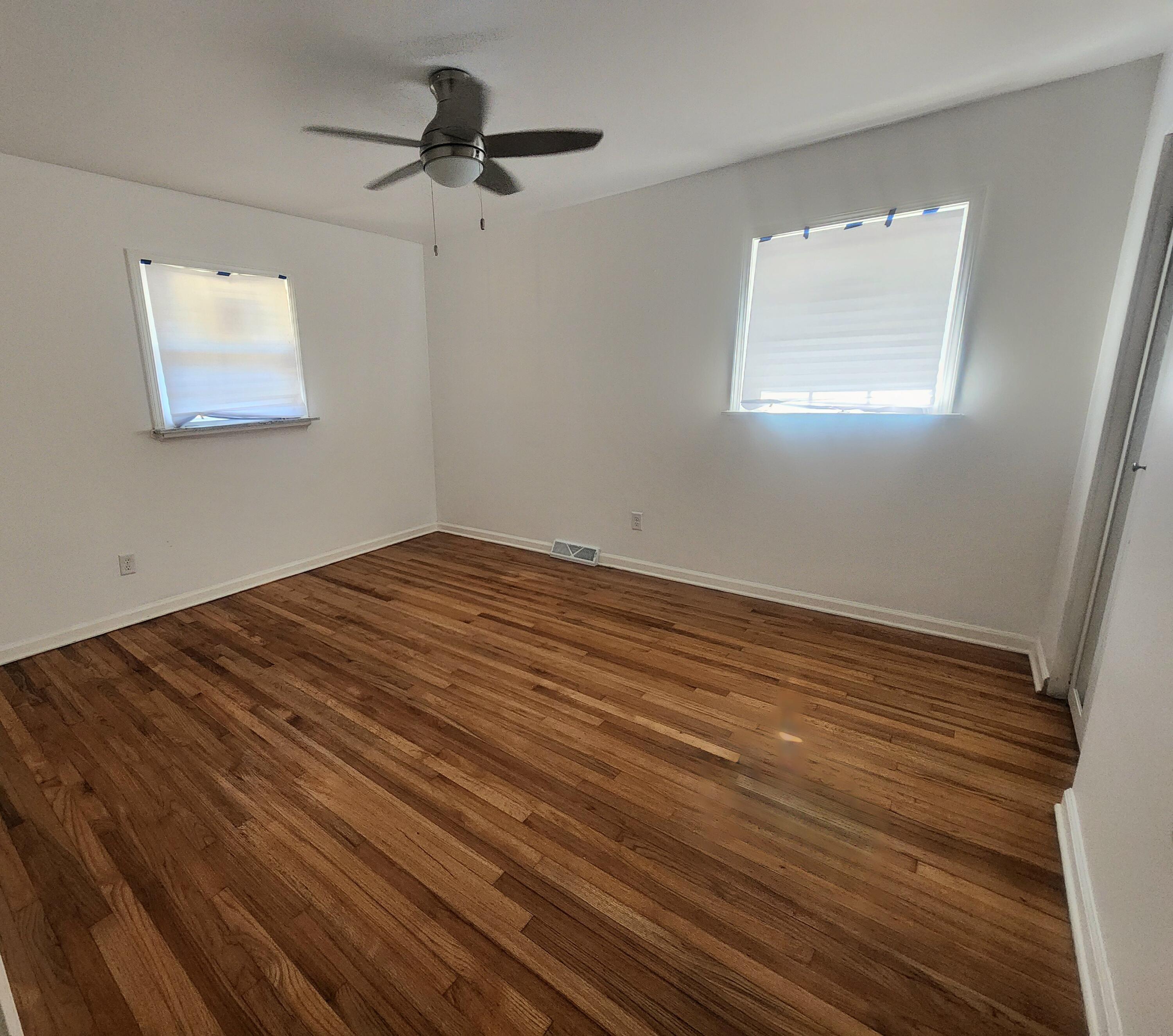 851 Johnson Street Gary, IN 46402 - Photo 7 of 24 a view of empty room with wooden floor