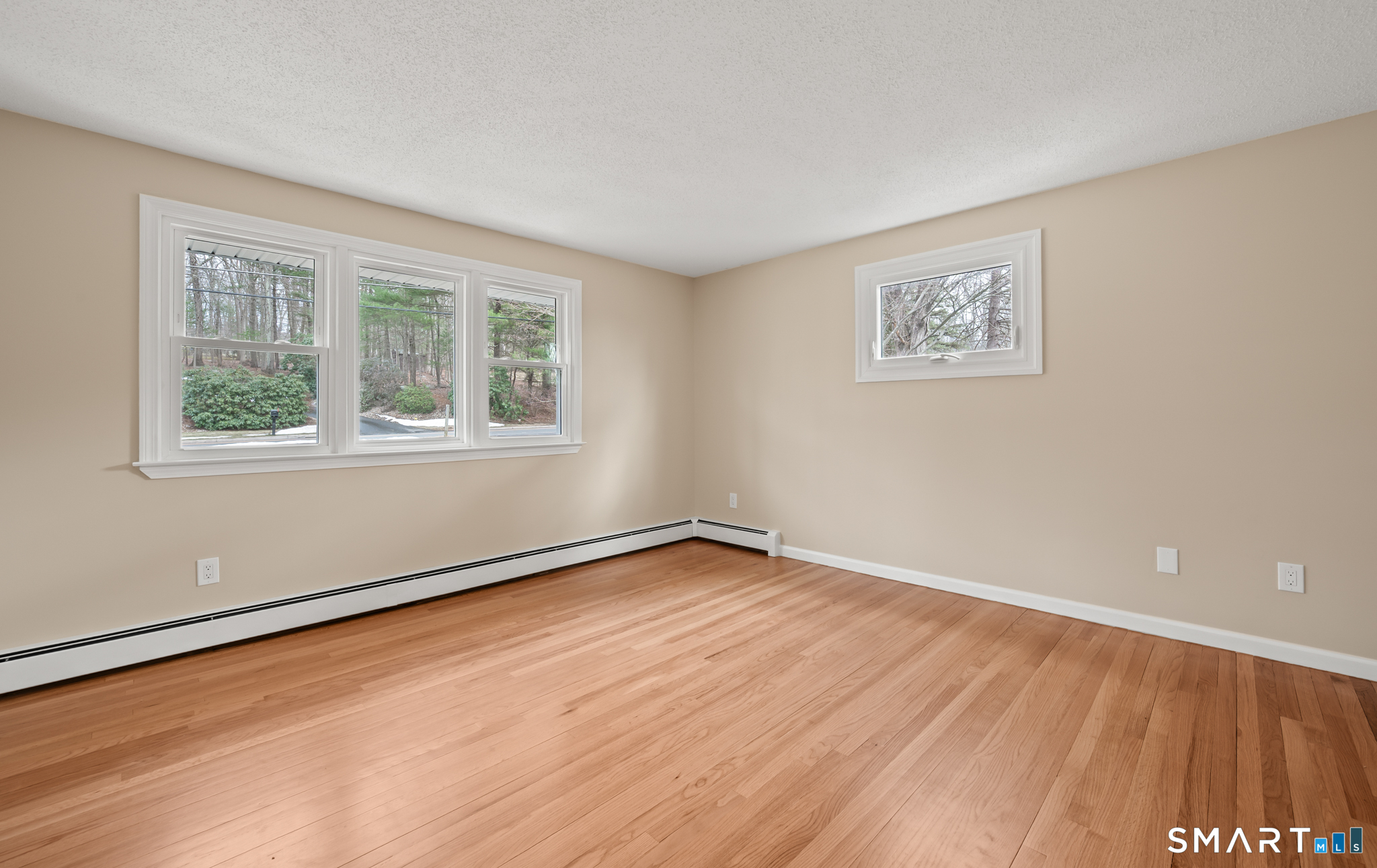 252 Blue Ridge Drive Manchester, CT 06040 - Photo 28 of 40 Spacious main floor bedroom with hardwood flooring and natural light.
