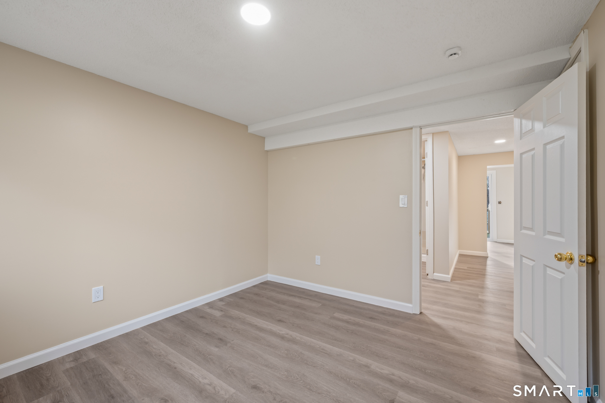 252 Blue Ridge Drive Manchester, CT 06040 - Photo 32 of 40 Lower-level bedroom with updated flooring.
