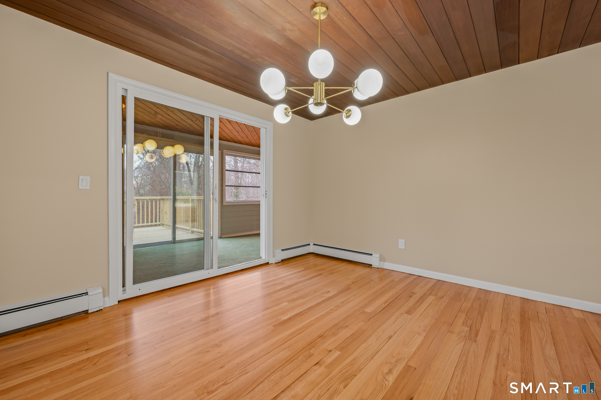 252 Blue Ridge Drive Manchester, CT 06040 - Photo 6 of 40 Dining space with wood ceiling detail and direct access to sunroom and deck.