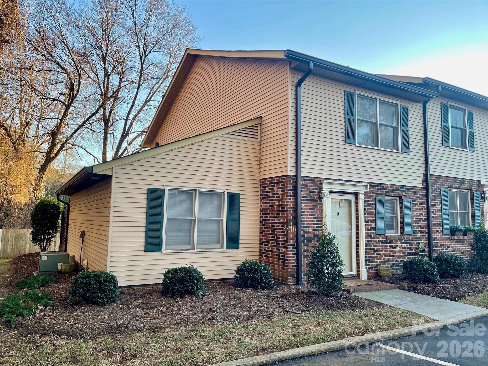 1330 5th Street Northeast, Unit 191 Hickory, NC 28601 - Photo 1 of 37 a view of a house with a yard and potted plants