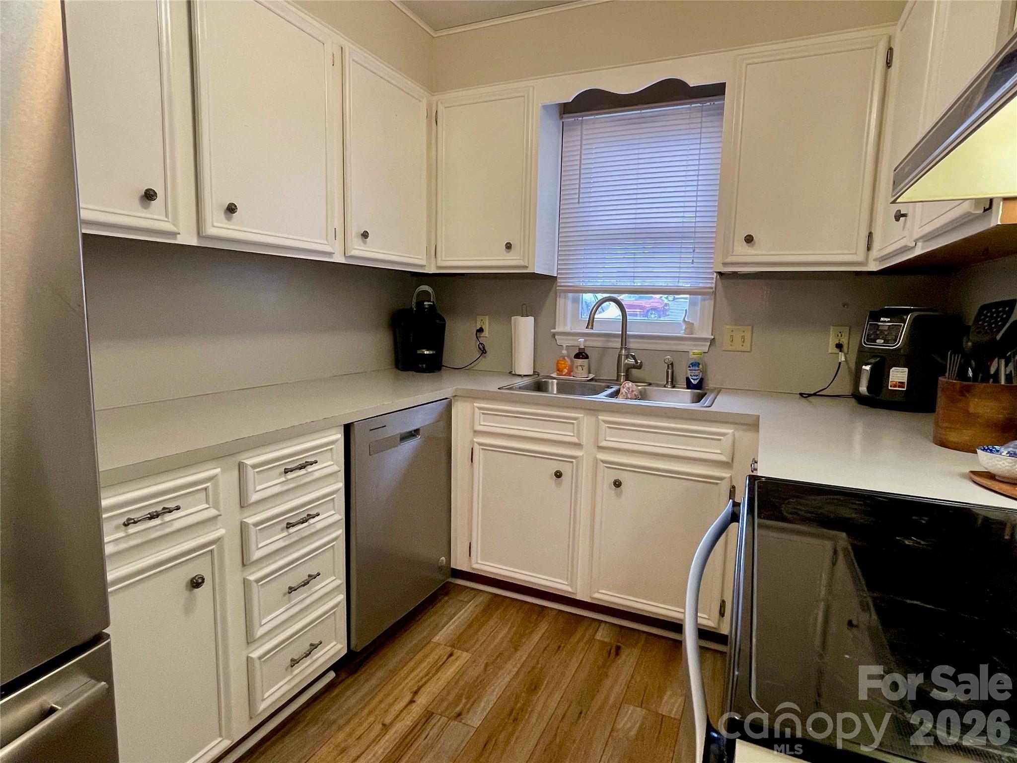 1330 5th Street Northeast, Unit 191 Hickory, NC 28601 - Photo 11 of 37 a kitchen with stainless steel appliances white cabinets and a sink