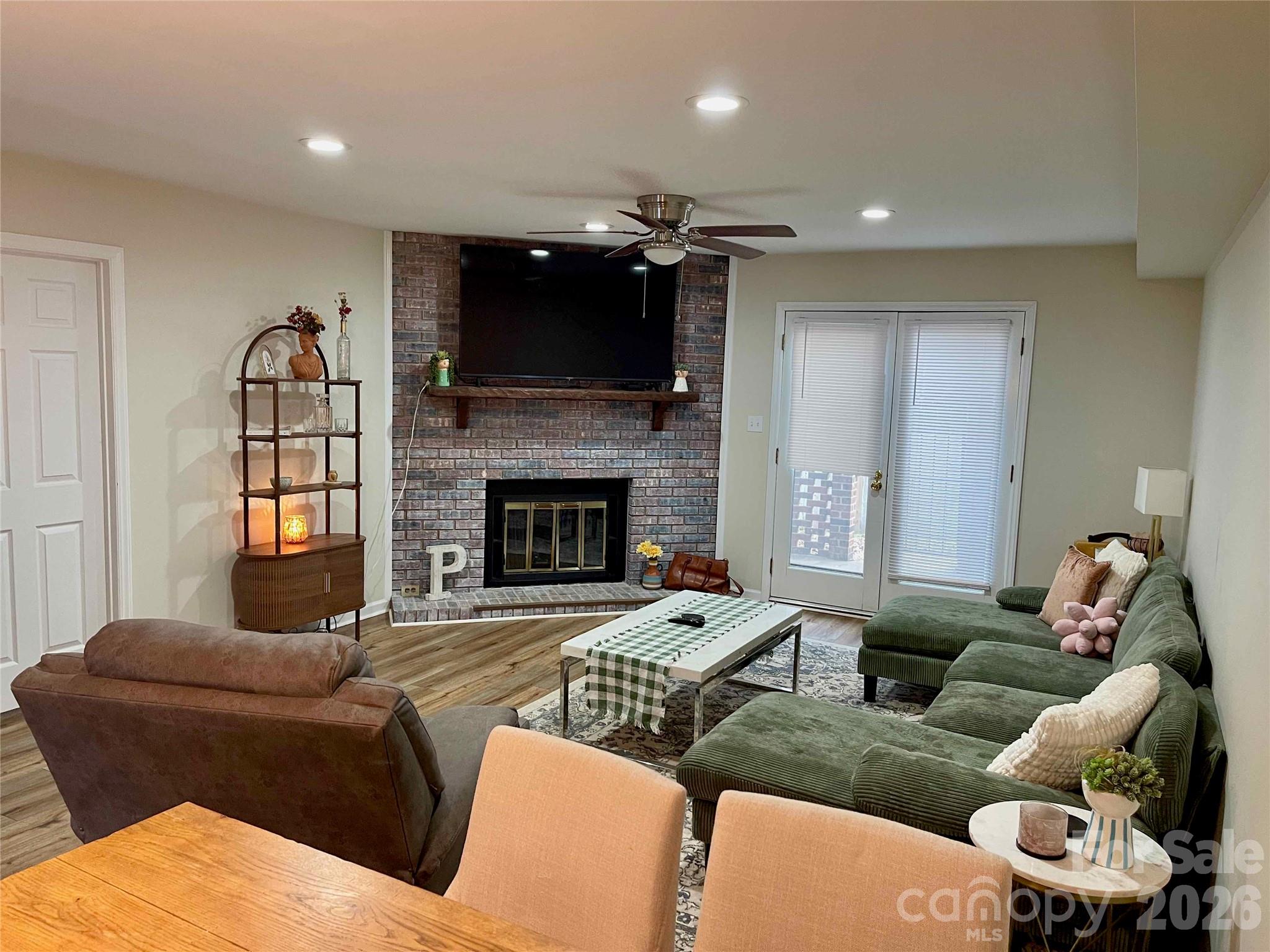 1330 5th Street Northeast, Unit 191 Hickory, NC 28601 - Photo 14 of 37 a living room with furniture and a fireplace