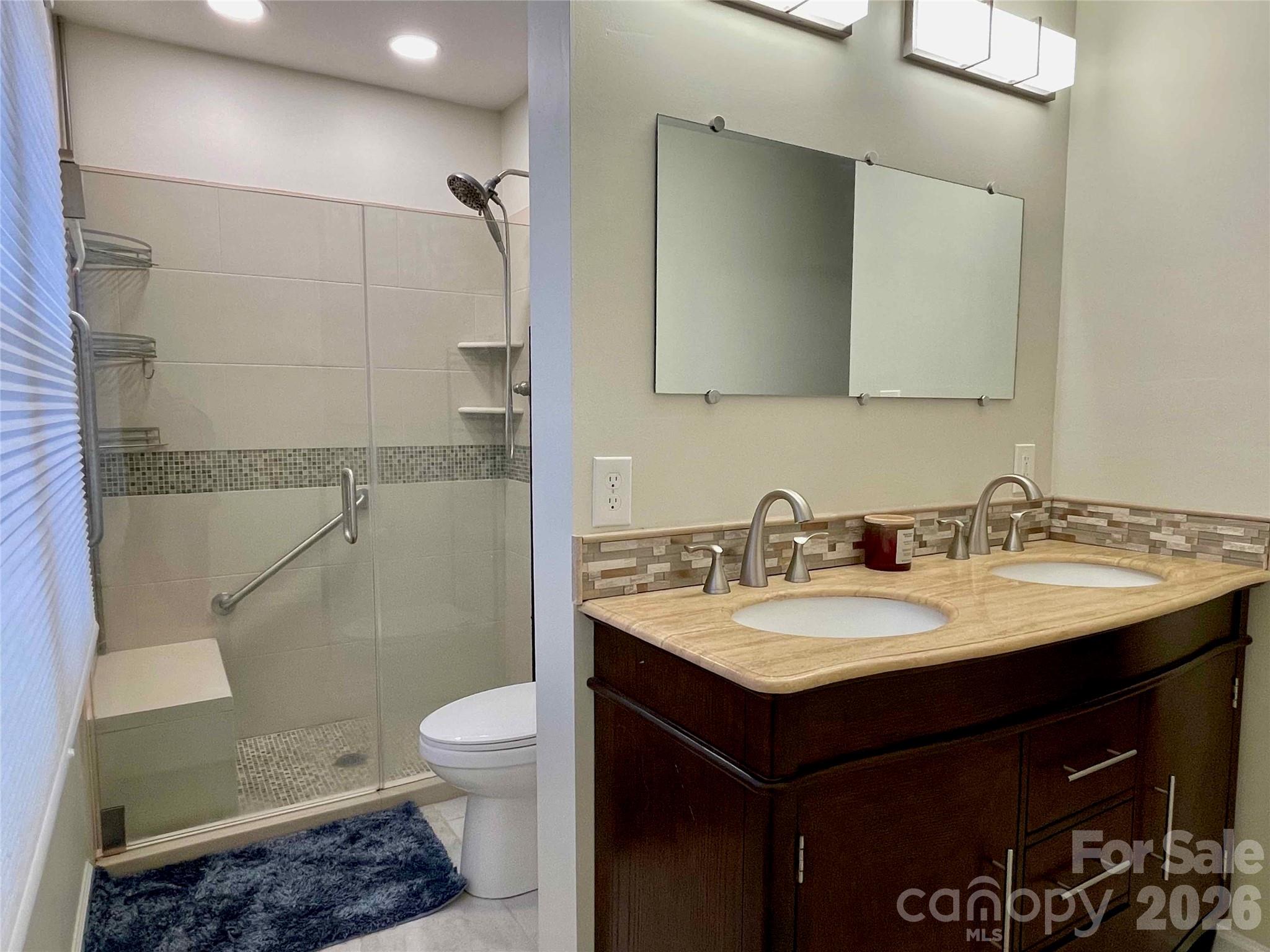 1330 5th Street Northeast, Unit 191 Hickory, NC 28601 - Photo 20 of 37 a bathroom with a granite countertop sink toilet and shower