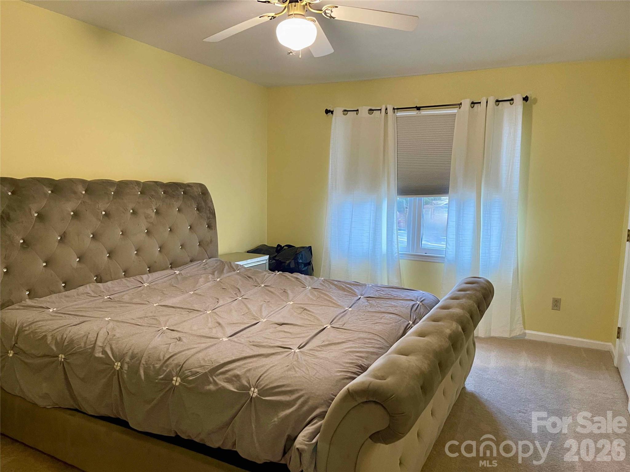 1330 5th Street Northeast, Unit 191 Hickory, NC 28601 - Photo 27 of 37 a bedroom with a bed and a painting on the wall
