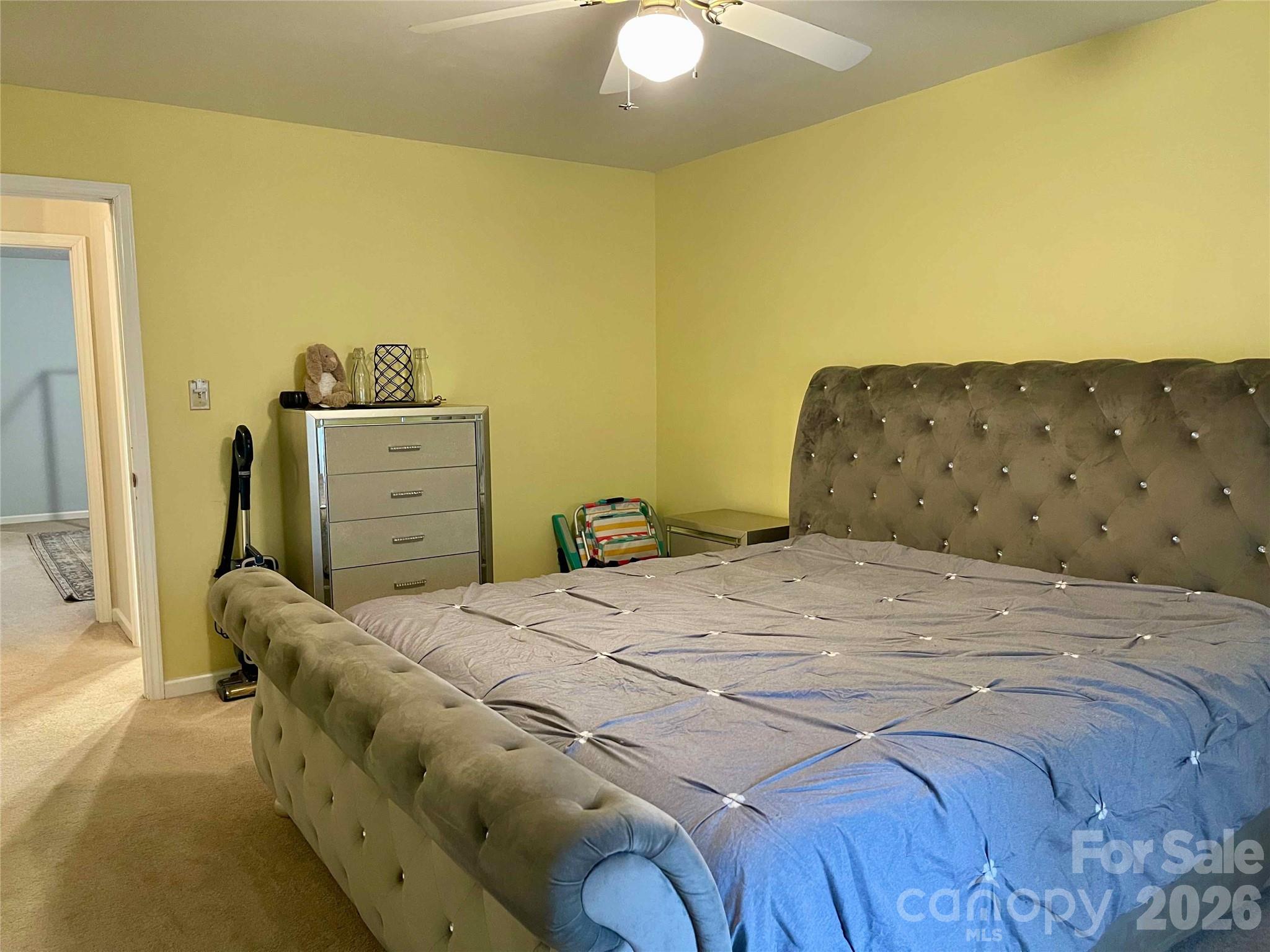 1330 5th Street Northeast, Unit 191 Hickory, NC 28601 - Photo 28 of 37 a bedroom with a bed and a chandelier