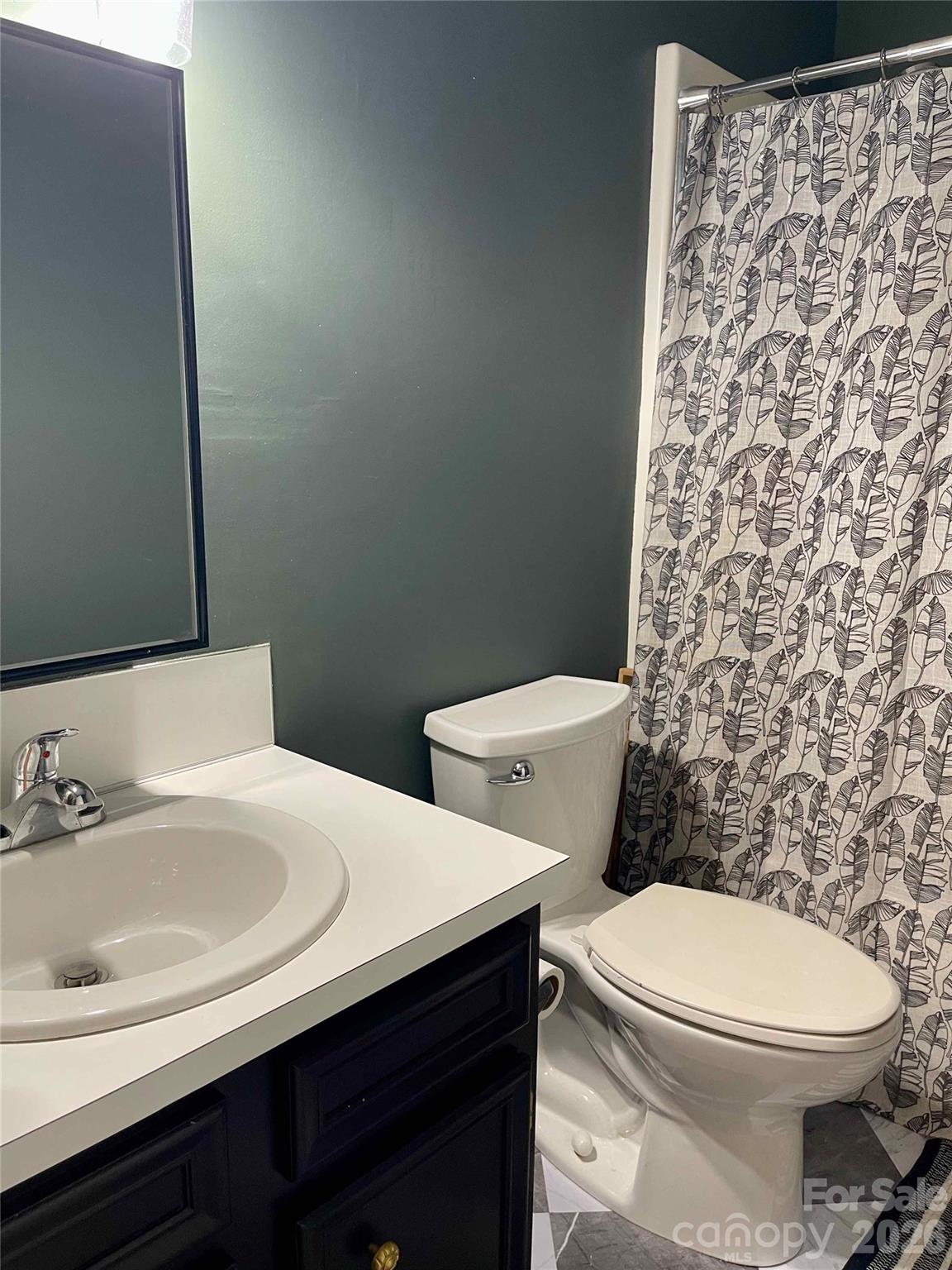 1330 5th Street Northeast, Unit 191 Hickory, NC 28601 - Photo 29 of 37 a white toilet sitting next to a bathroom sink