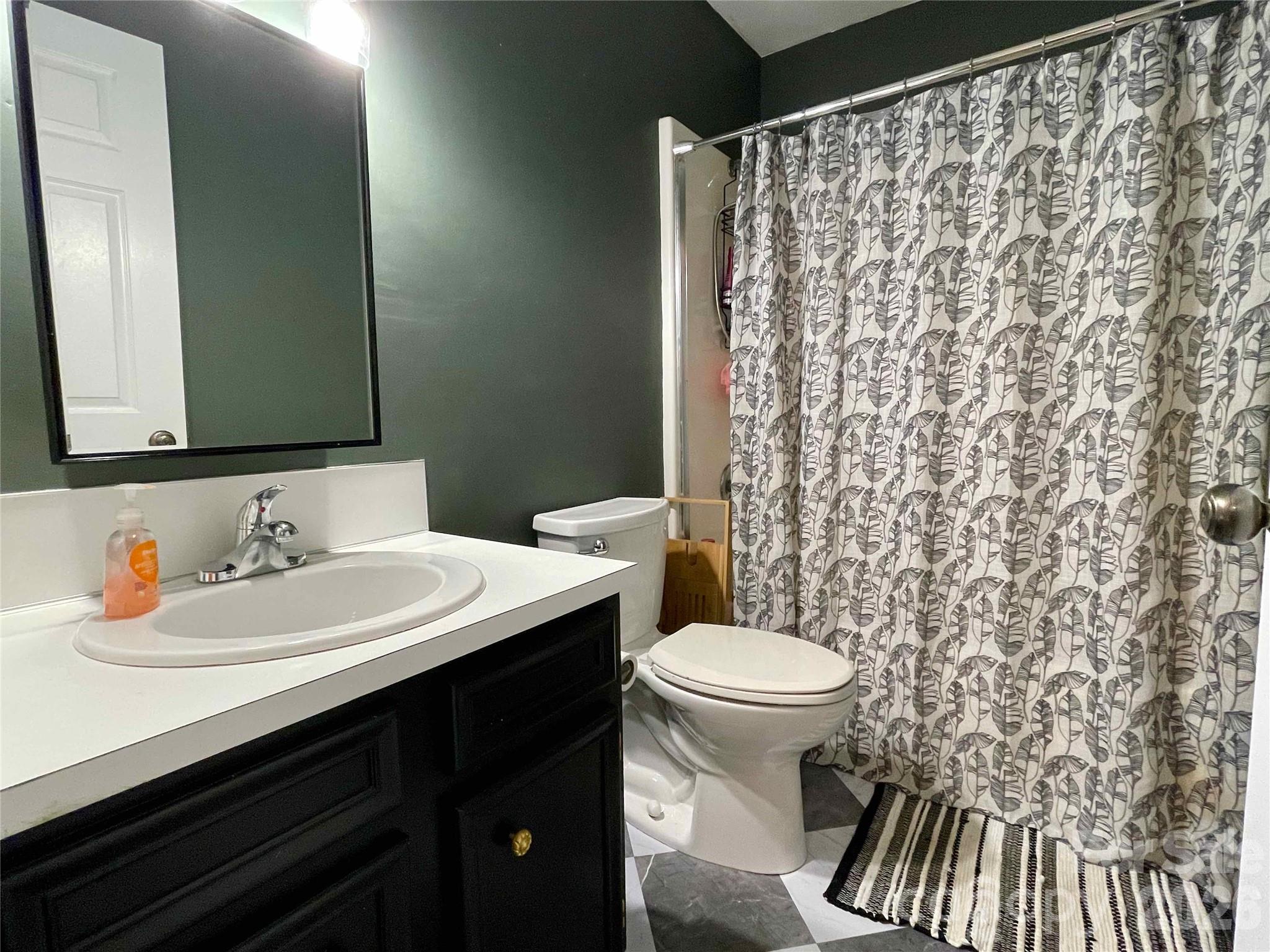 1330 5th Street Northeast, Unit 191 Hickory, NC 28601 - Photo 30 of 37 a bathroom with a sink and a mirror