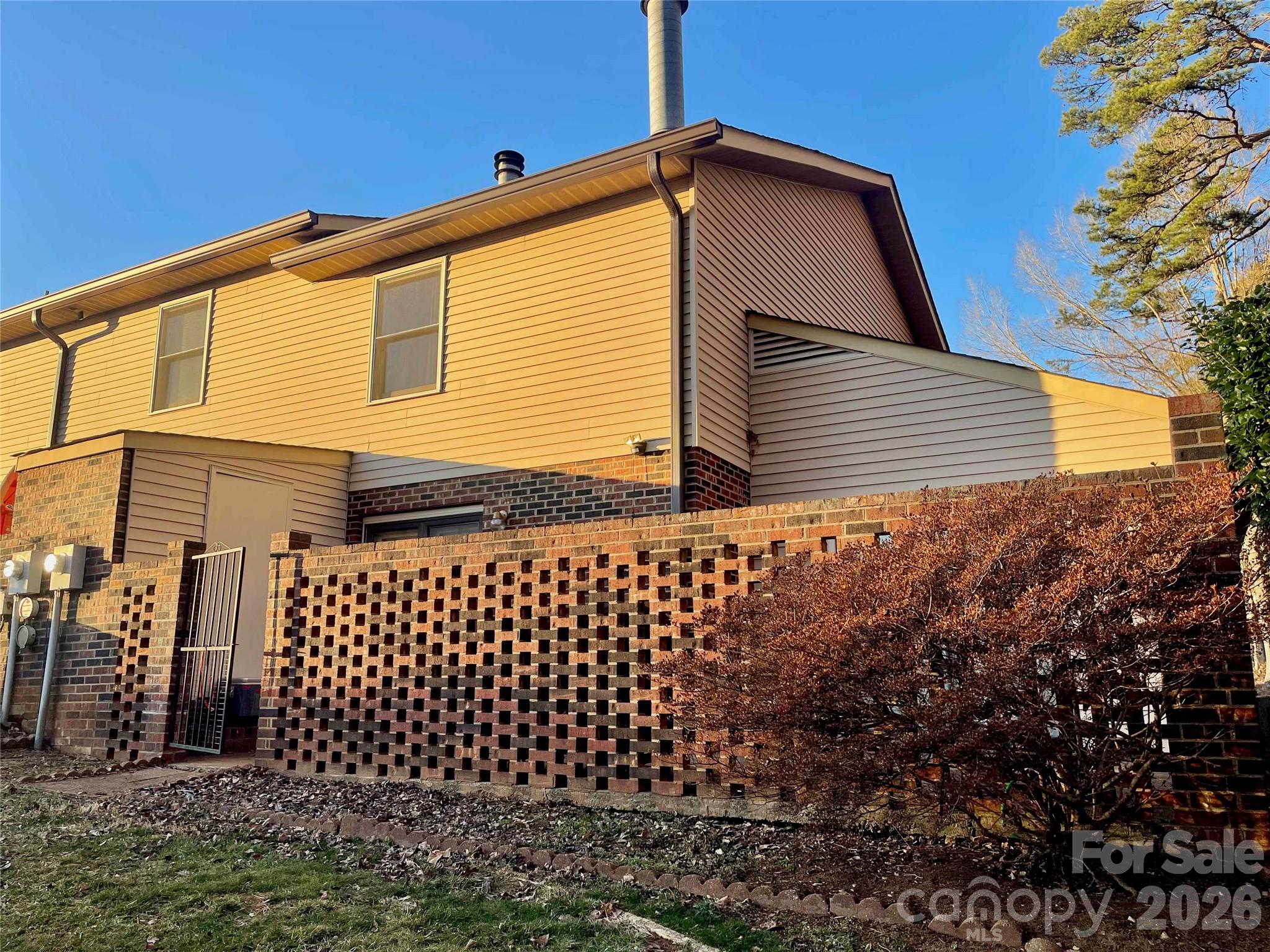 1330 5th Street Northeast, Unit 191 Hickory, NC 28601 - Photo 35 of 37 a back view of a house with a door