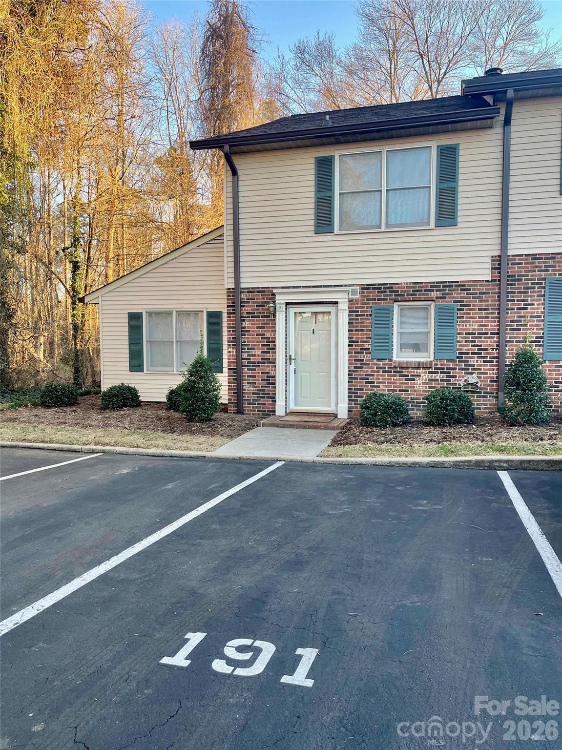 1330 5th Street Northeast, Unit 191 Hickory, NC 28601 - Photo 36 of 37 a front view of a house with a yard and garage