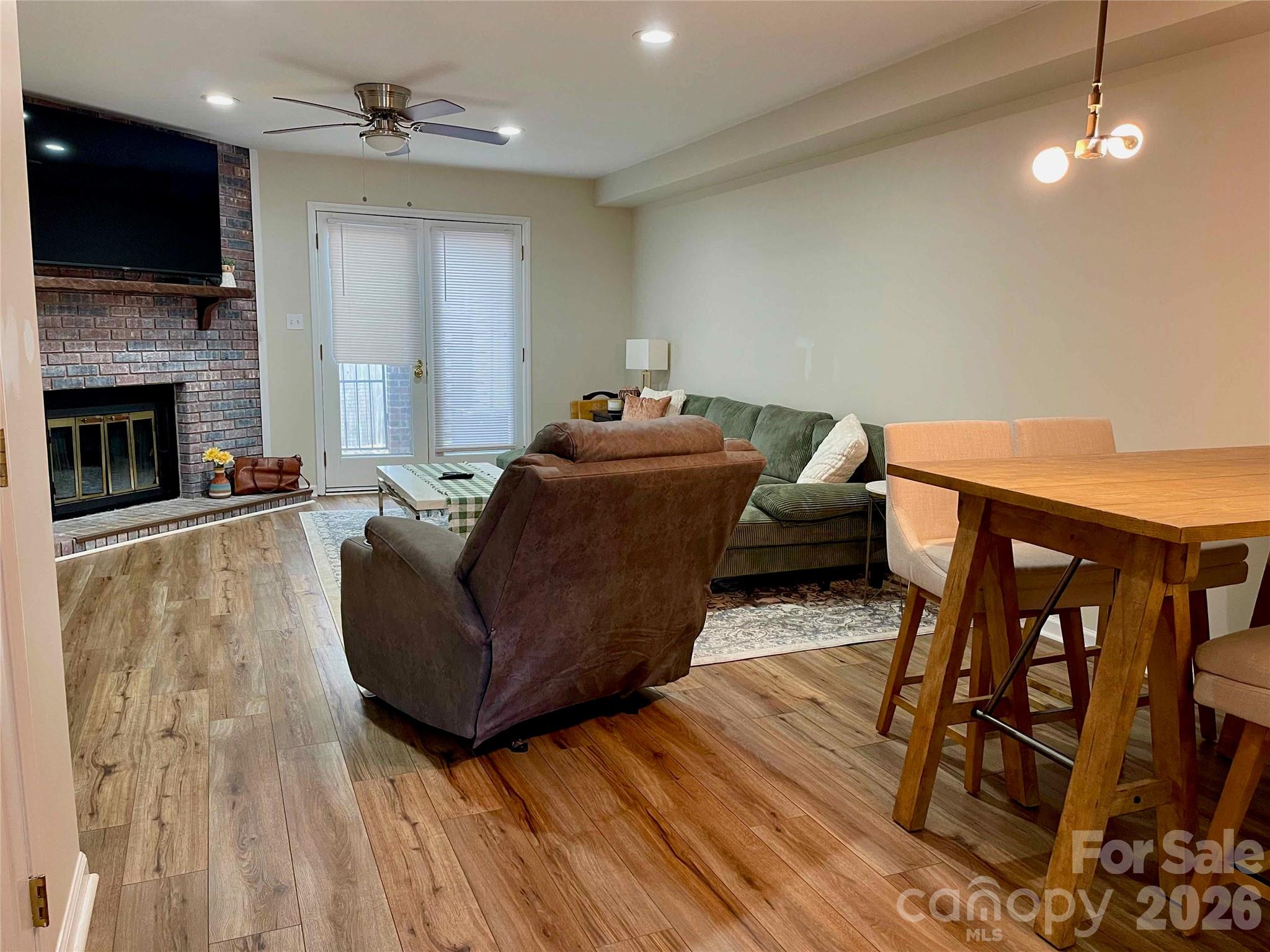1330 5th Street Northeast, Unit 191 Hickory, NC 28601 - Photo 5 of 37 a living room with furniture and a flat screen tv