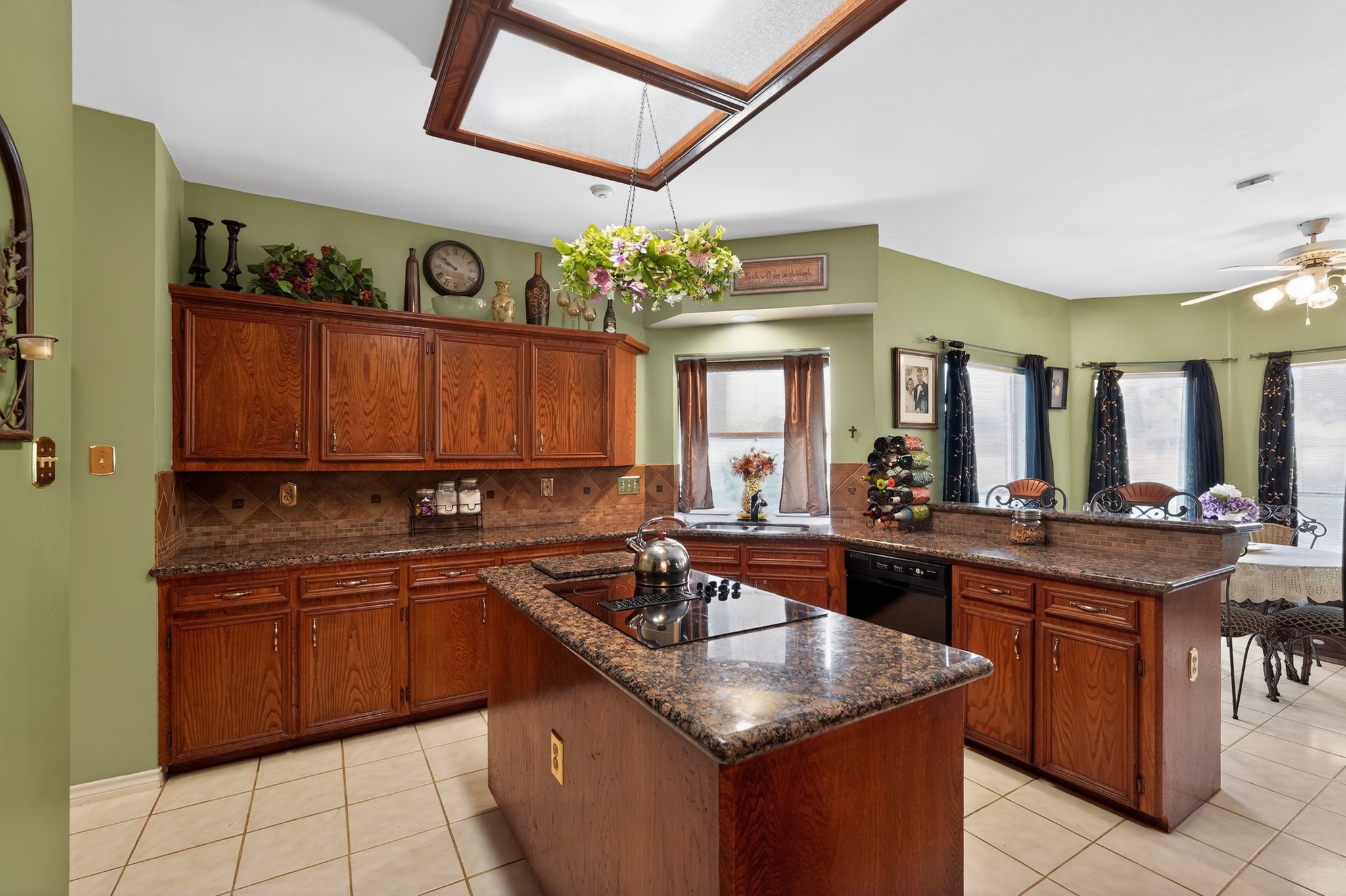 19027 Relay Road Humble, TX 77346 - Photo 10 of 29 Open-concept kitchen featuring a large center island with cooktop.