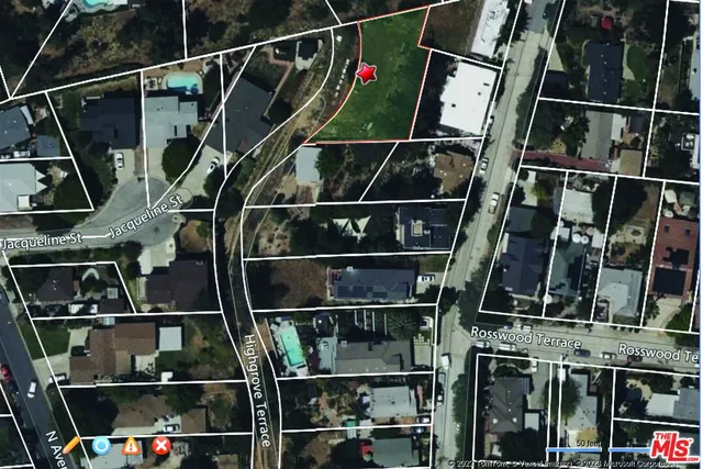 an aerial view of residential house with outdoor space