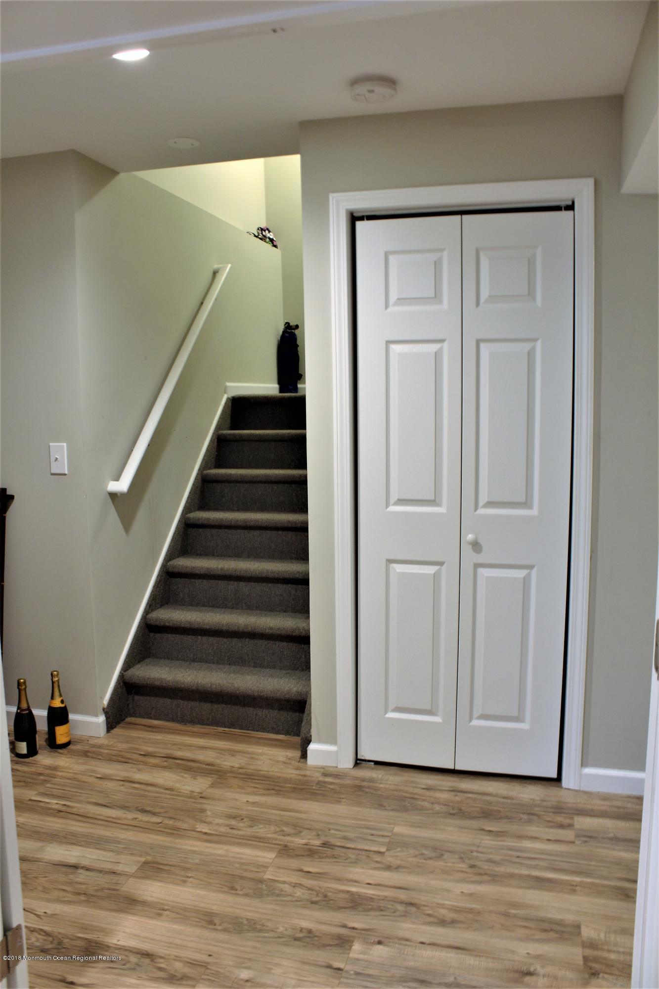 32 Netty Street Howell, NJ 07731 - Photo 35 of 52 stairs leading up from finished basement