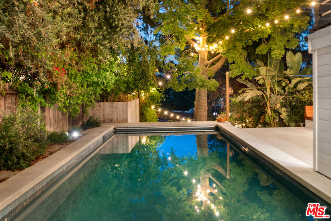 1530 Elevado Street Los Angeles, CA 90026 - Photo 4 of 44 a view of swimming pool with a back yard