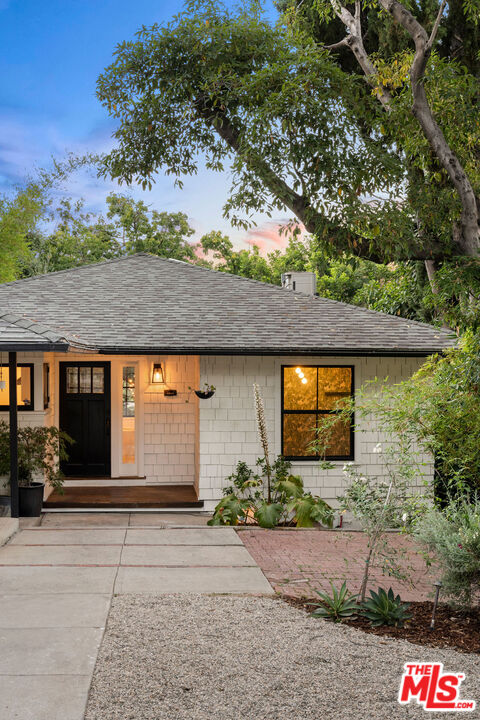 1530 Elevado Street Los Angeles, CA 90026 - Photo 7 of 44 a front view of a house with a yard and garage