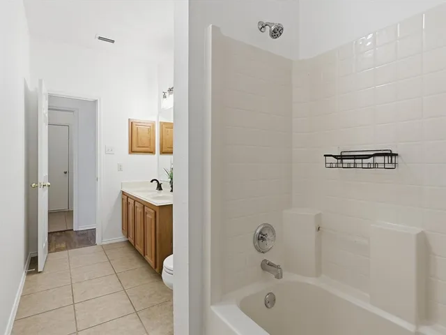 a bathroom with a bathtub sink and toilet
