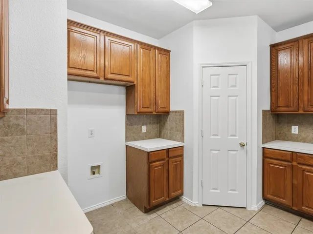 a view of cabinets with wooden floor