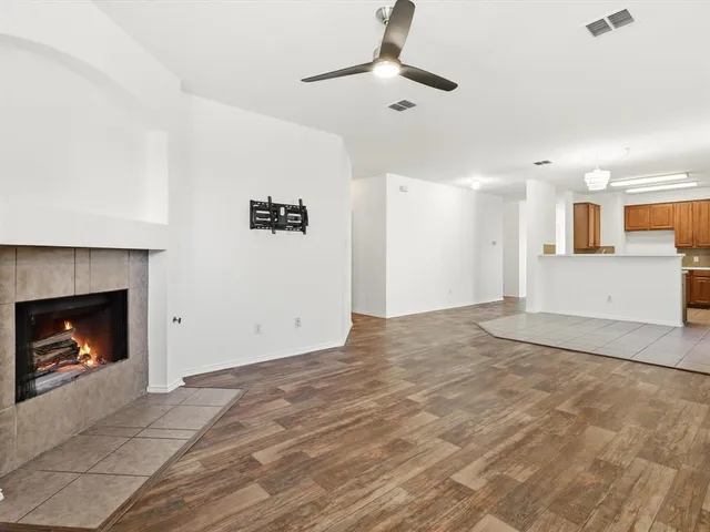 a view of an empty room with a fireplace
