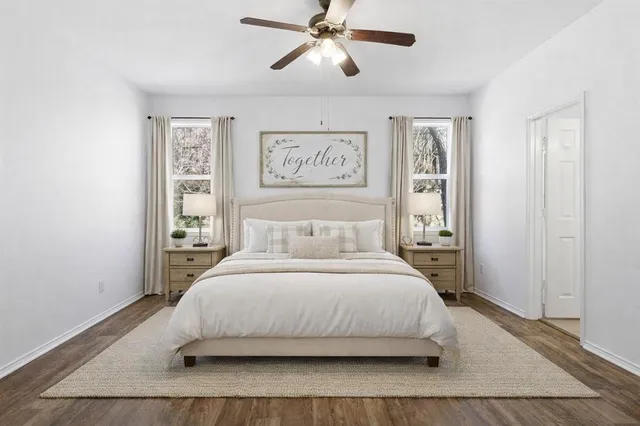 a bedroom with a bed and window