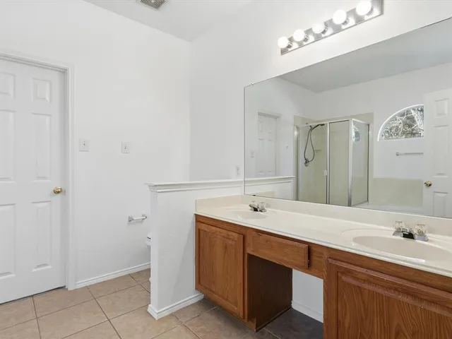 a bathroom with a sink a vanity and a mirror
