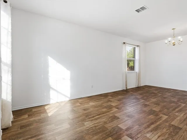a view of an empty room and window