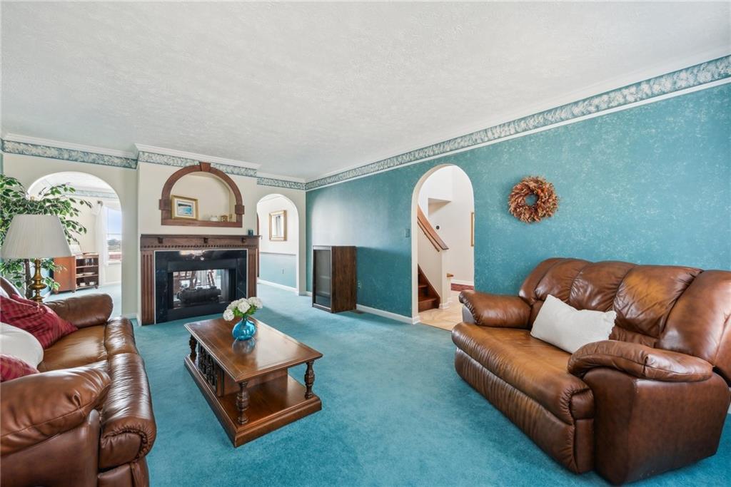 320 Talon Drive Irwin, PA 15642 - Photo 11 of 37 a living room with furniture and a fireplace