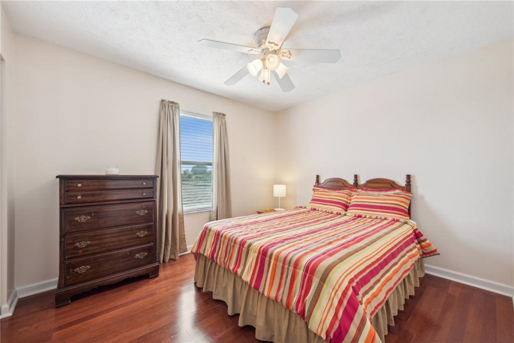 320 Talon Drive Irwin, PA 15642 - Photo 21 of 37 a bedroom with a bed and a chandelier