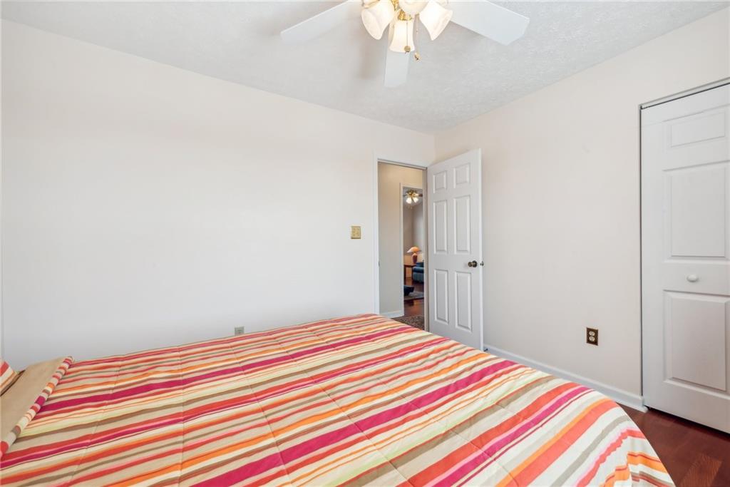 320 Talon Drive Irwin, PA 15642 - Photo 22 of 37 a bedroom with a bed and a chandelier