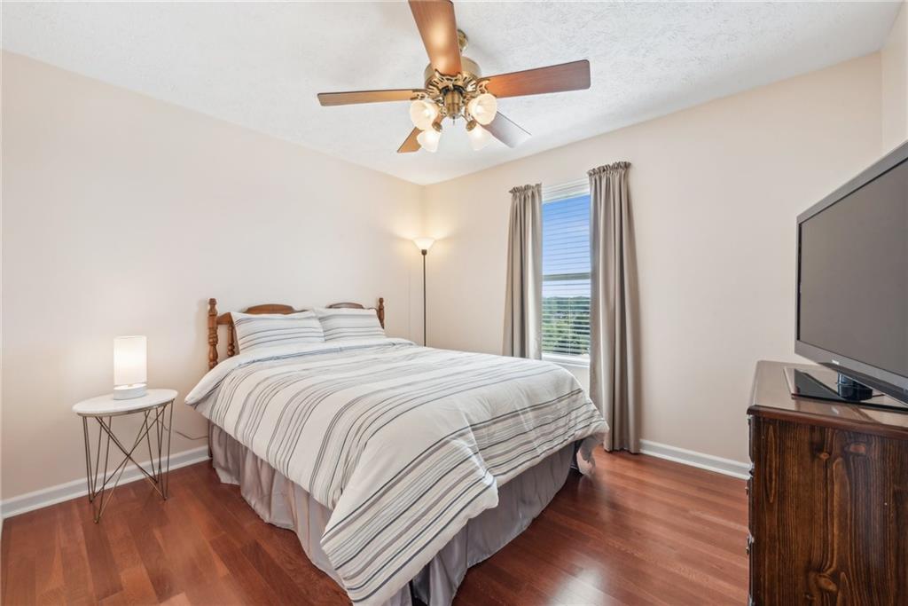 320 Talon Drive Irwin, PA 15642 - Photo 23 of 37 a bedroom with a bed and a flat tv screen on a dresser