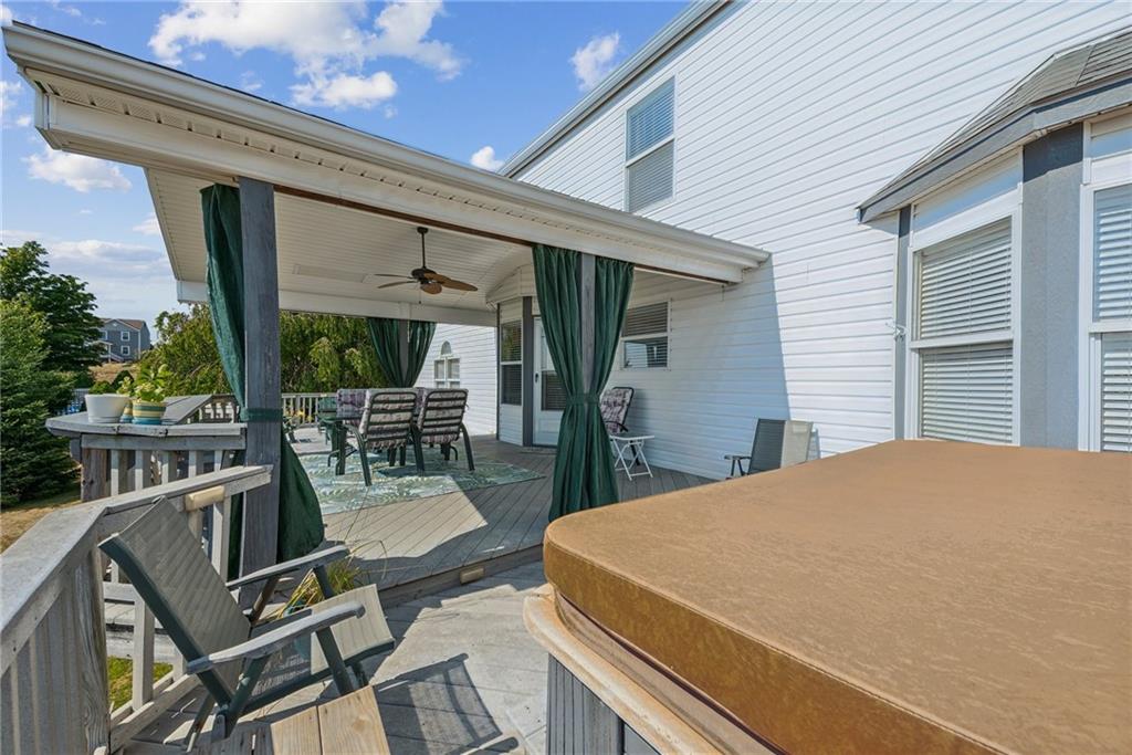 320 Talon Drive Irwin, PA 15642 - Photo 28 of 37 a view of a patio with table and chairs potted plants with wooden floor and fence