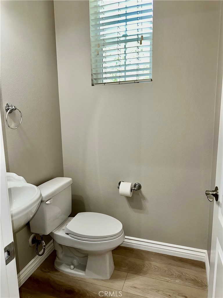 21 Durlston Way Ladera Ranch, CA 92694 - Photo 39 of 47 a white toilet sitting next to a bathroom sink