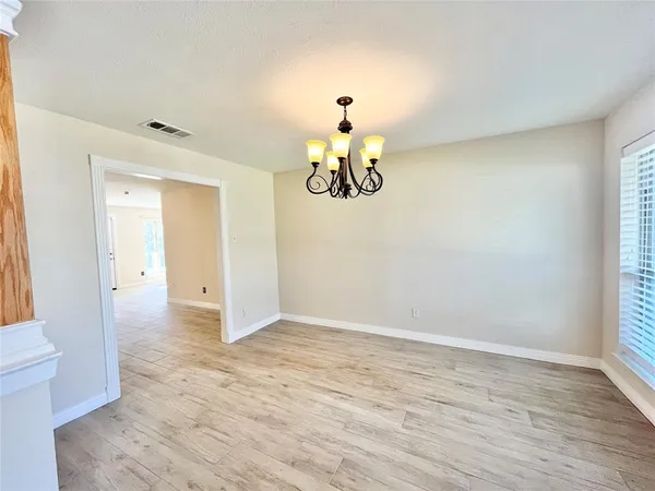 a view of an empty room and window
