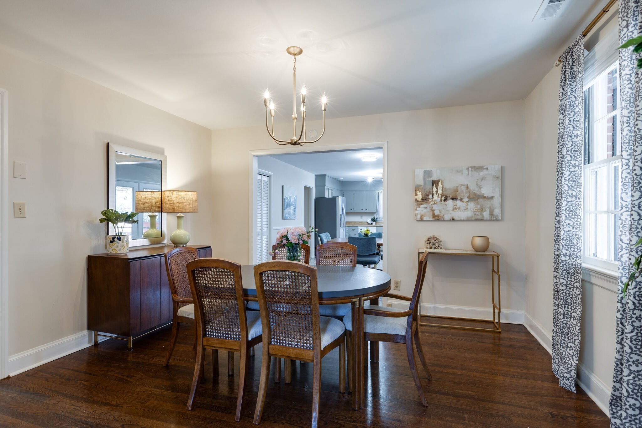 1335 Adams Street Franklin, TN 37064 - Photo 16 of 39 a view of a dining room with furniture wooden floor and chandelier