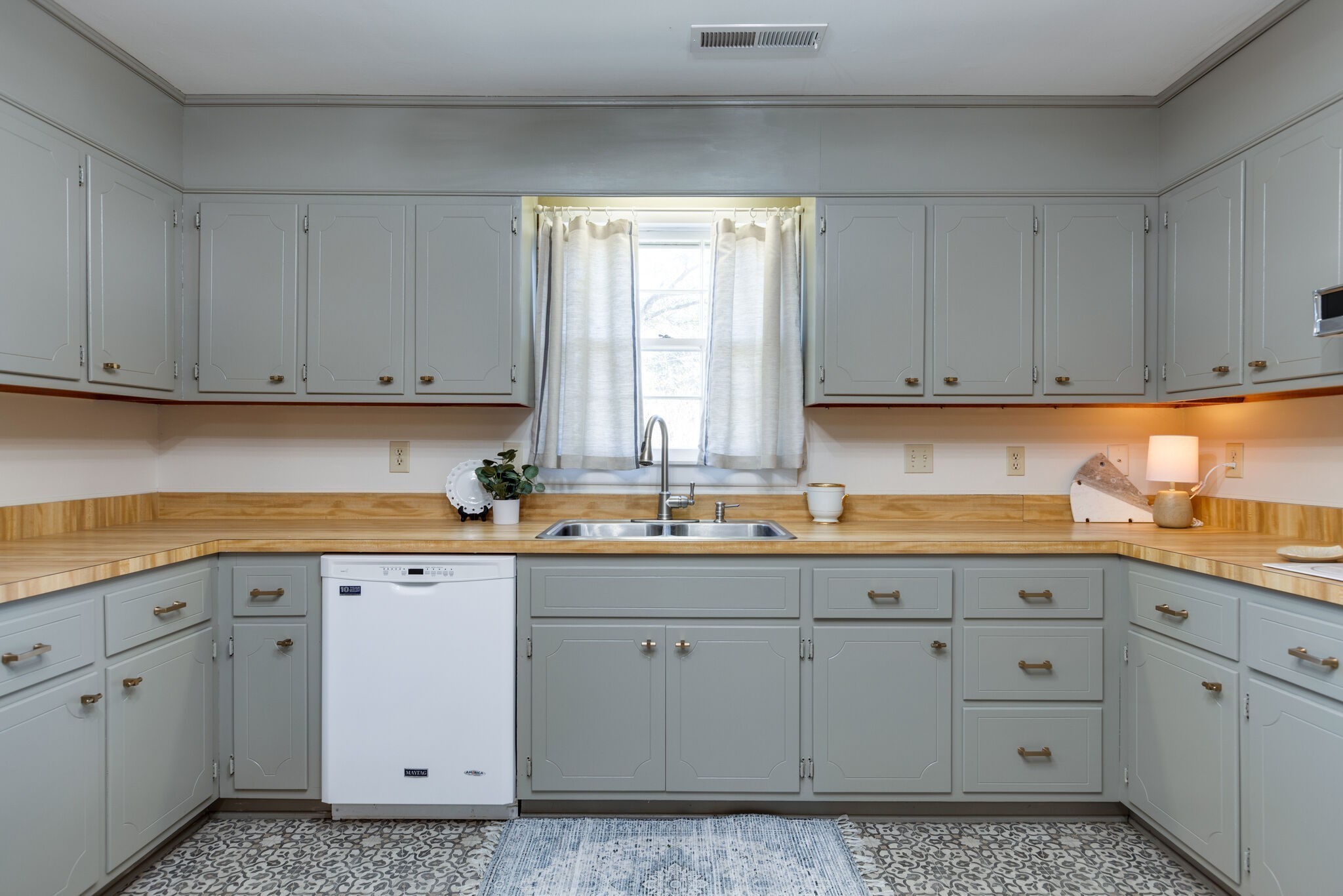 1335 Adams Street Franklin, TN 37064 - Photo 21 of 39 a kitchen with white cabinets and white appliances