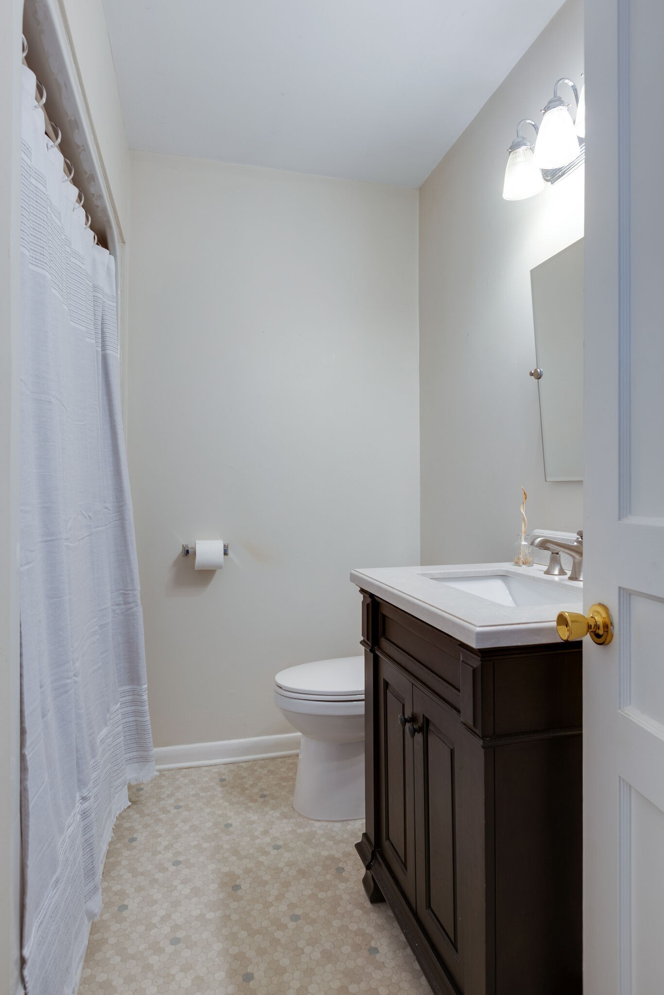 1335 Adams Street Franklin, TN 37064 - Photo 26 of 39 a bathroom with a sink a toilet a mirror and vanity