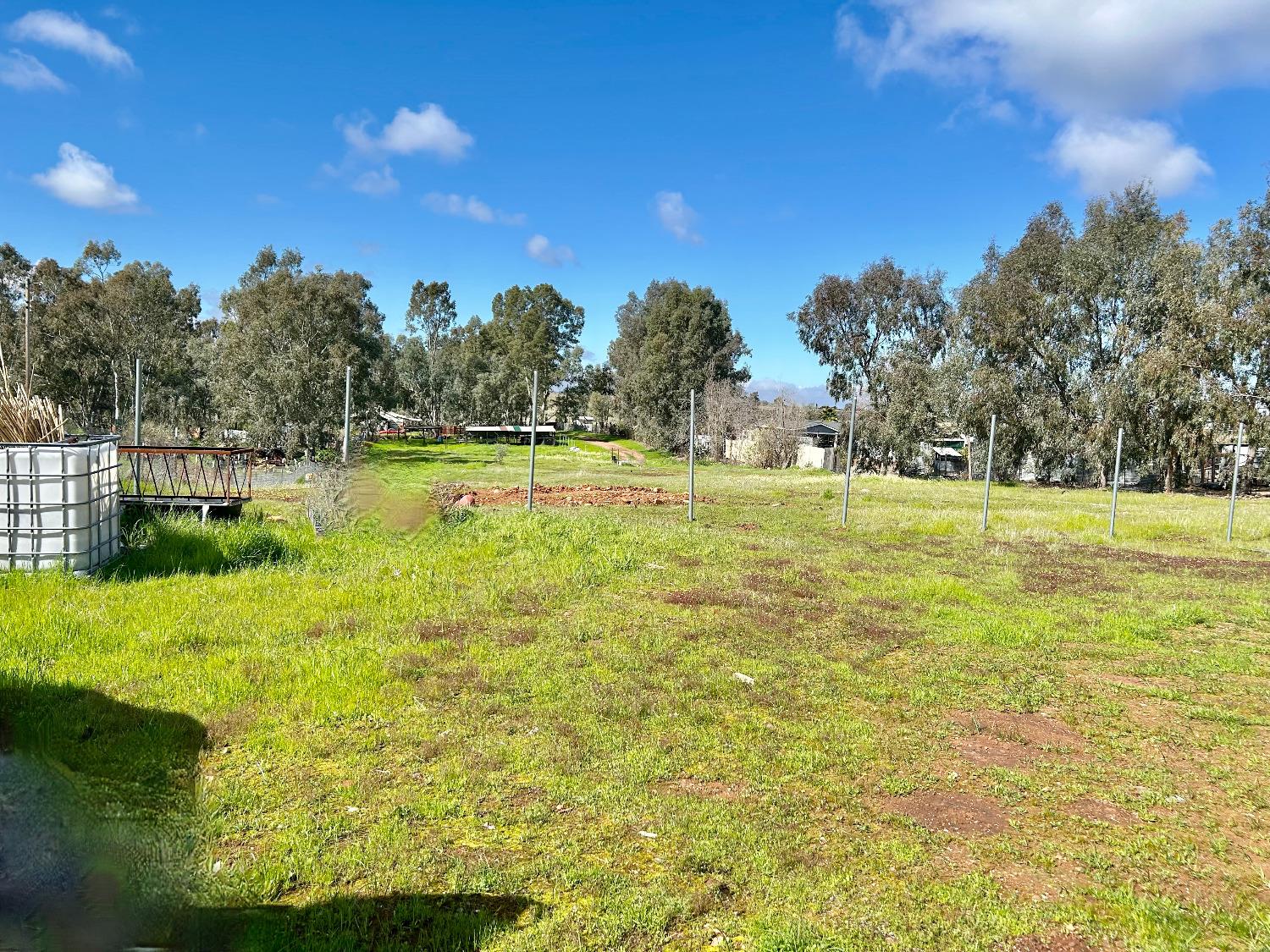 265 Lone Tree Road Oroville, CA 95965 - Photo 15 of 26 a view of a swimming pool with an outdoor space and seating area