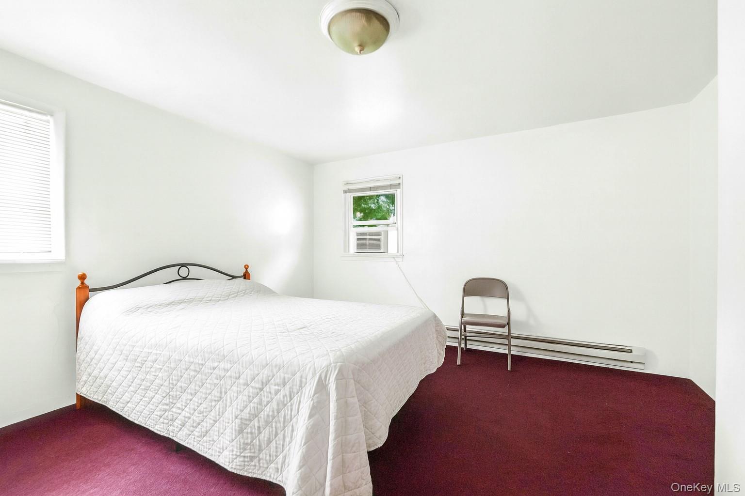 139 Spring Street Ossining, NY 10562 - Photo 16 of 29 Bedroom with a baseboard radiator and carpet floors