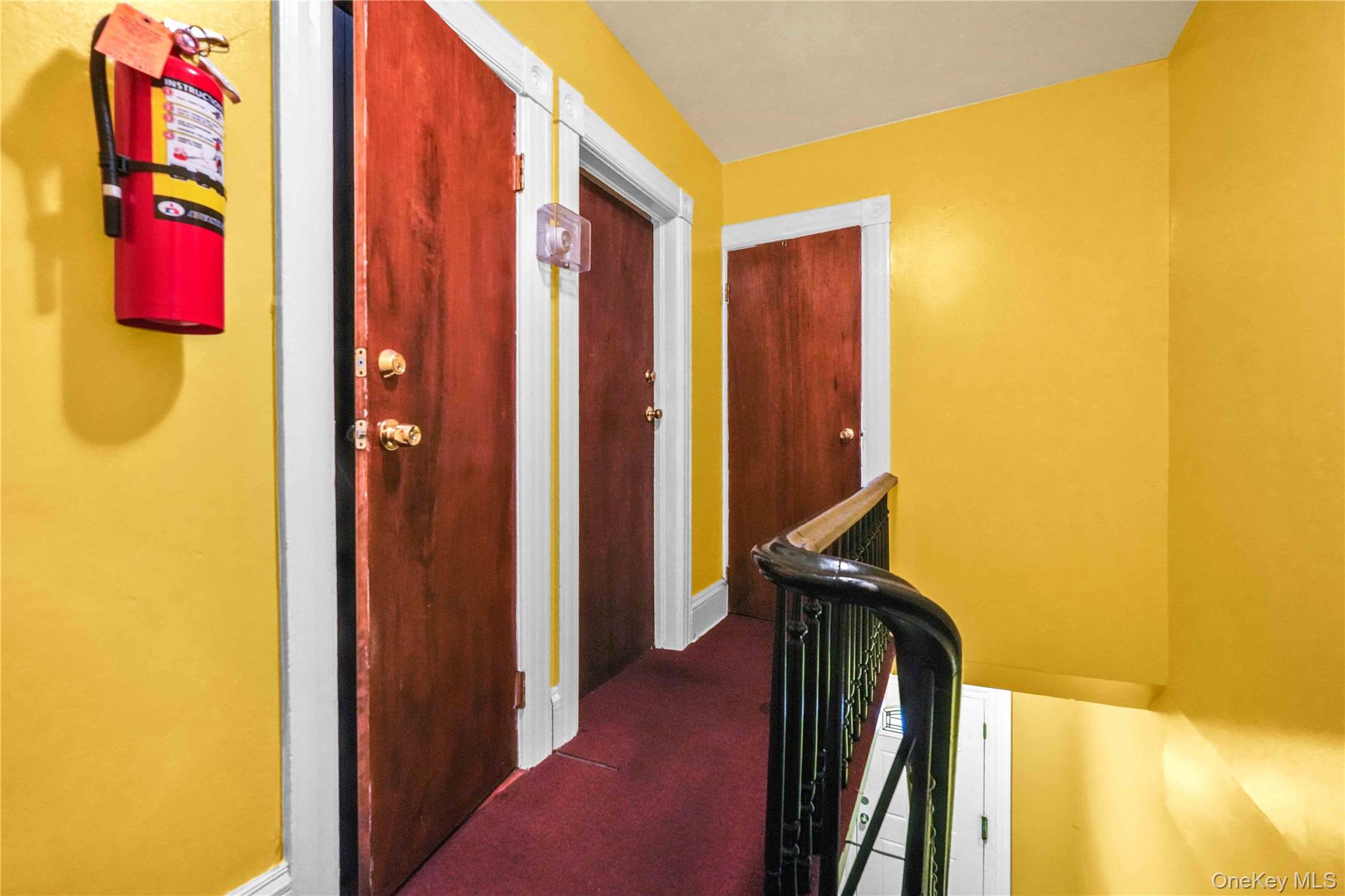 139 Spring Street Ossining, NY 10562 - Photo 18 of 29 Hall with an upstairs landing and dark carpet